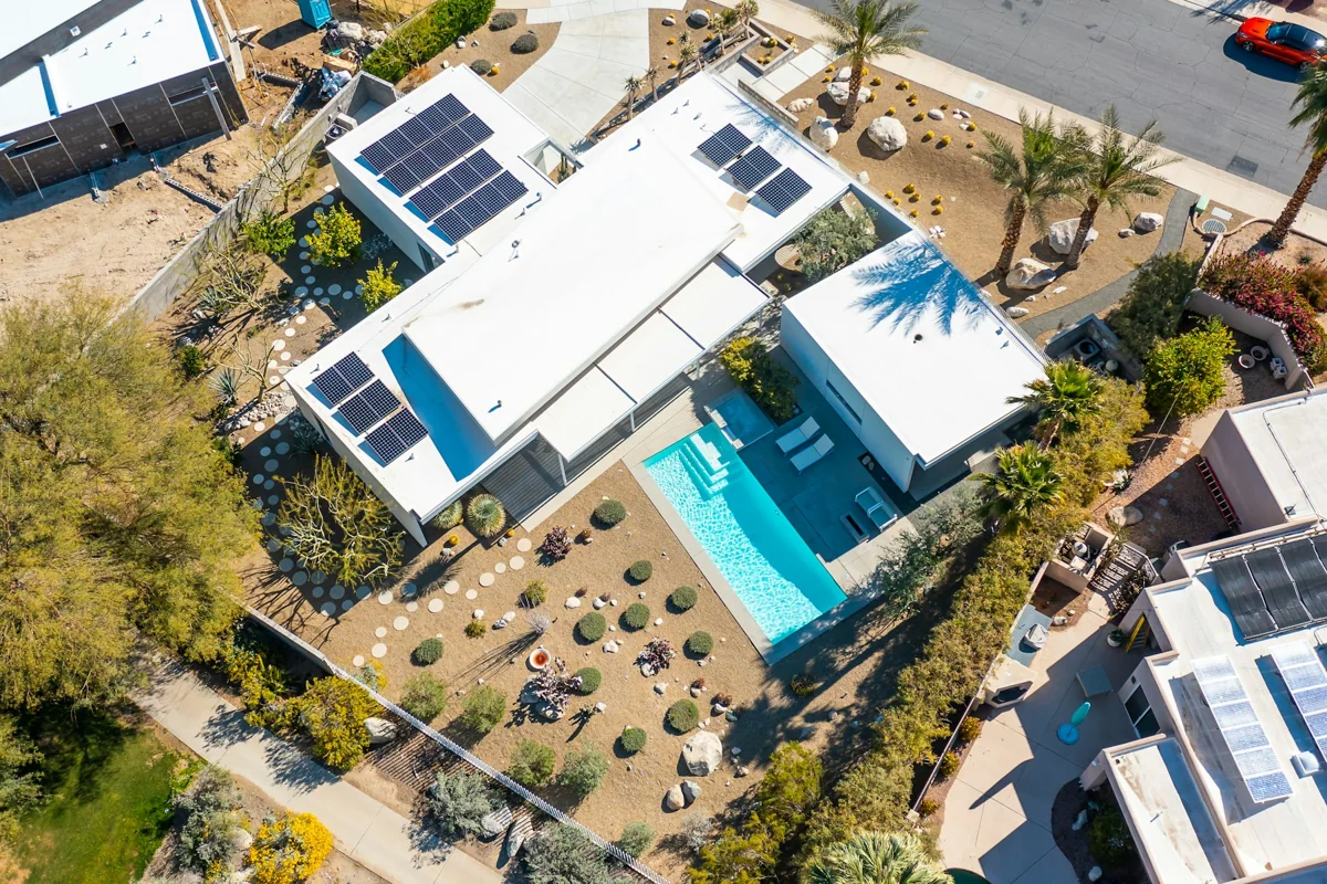 Aerial photograph of a modern home with rooftop solar panels