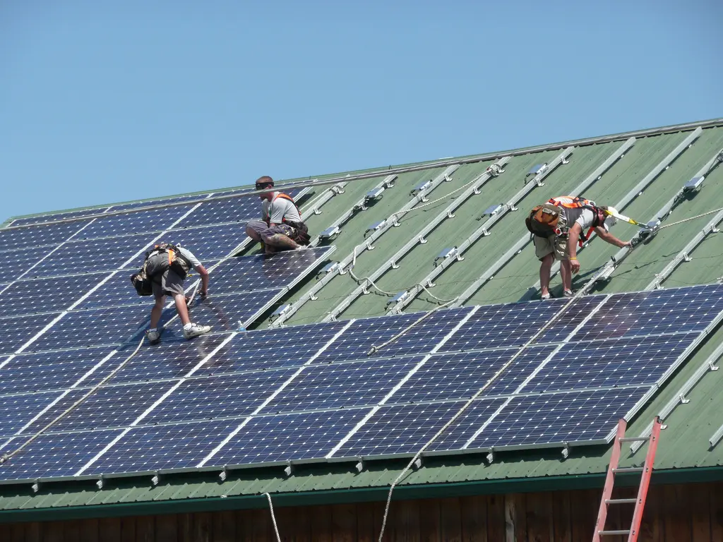 Workers installing solar panels at a veterinary hospital in Littlestown, Pennsylvania